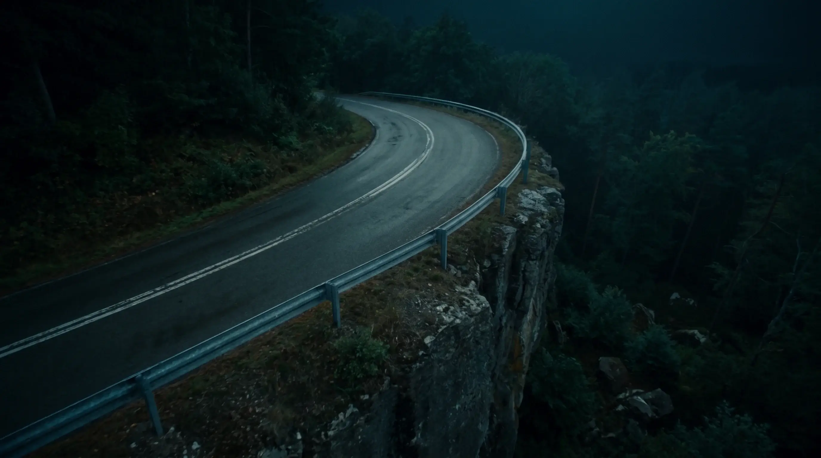 The dark road along the cliff